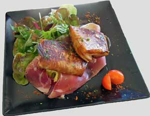 photo of cheese in pastry with strips of serrano ham